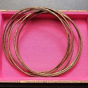 7 Brass /Goldish bracelets connected